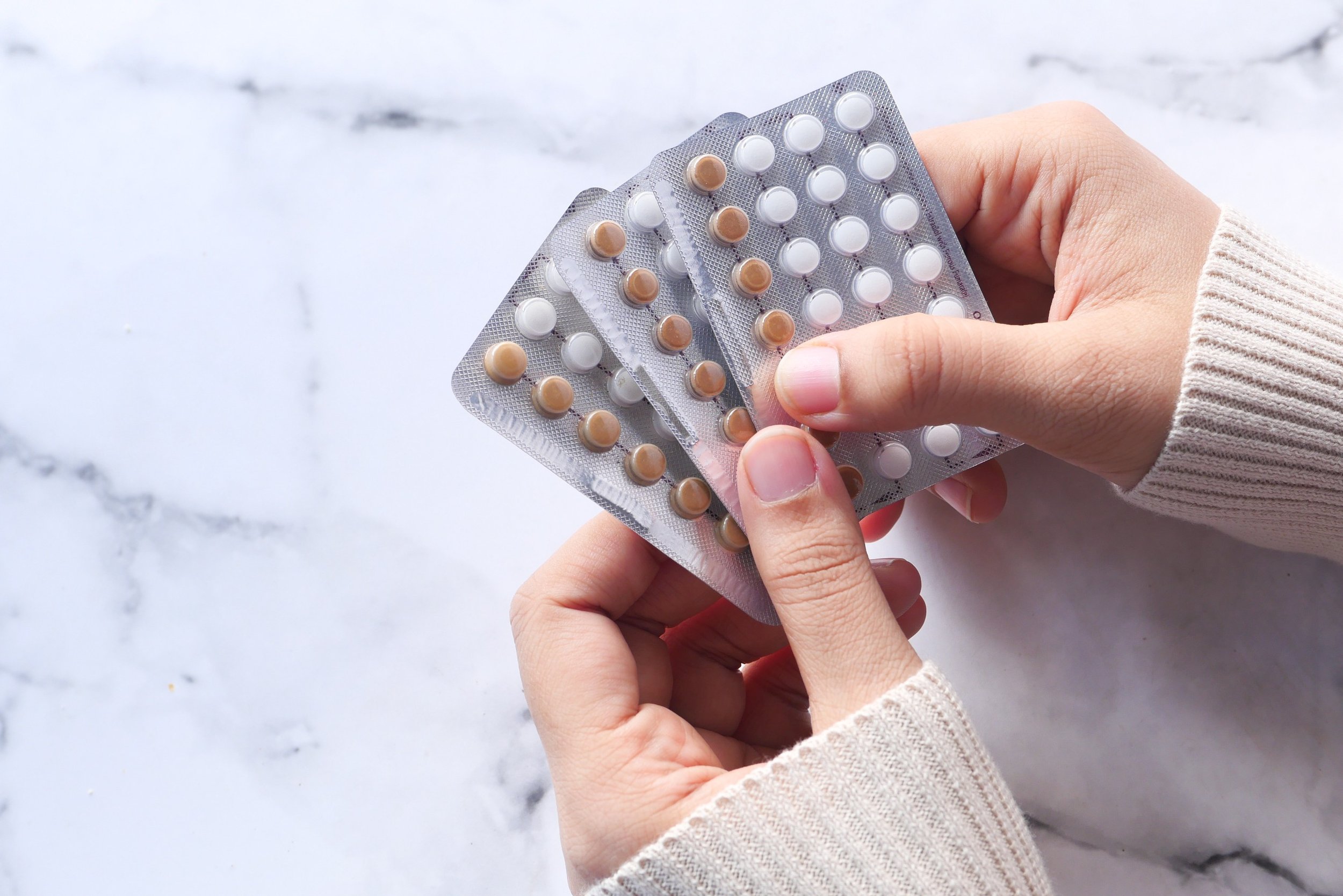 holding birth control pills