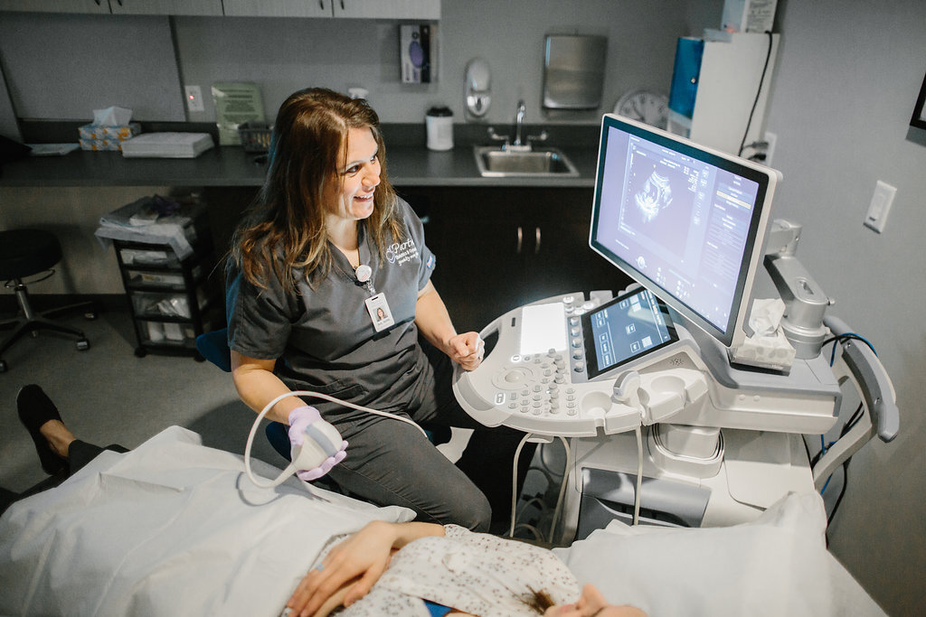 Medical professional doing an ultrasound on a patient